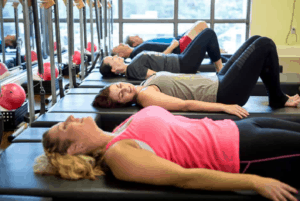 Clients in their 40s, 50s, and 60s at MatWorkz Pilates exercising