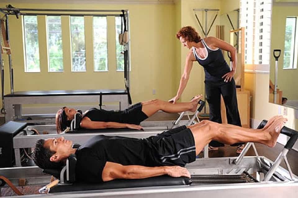 Man taking a Reformer Pilates' Class at MatWorkz Pilates