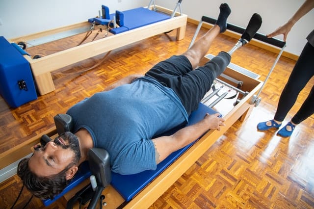 Client concentrates to connect mind and body during Pilates