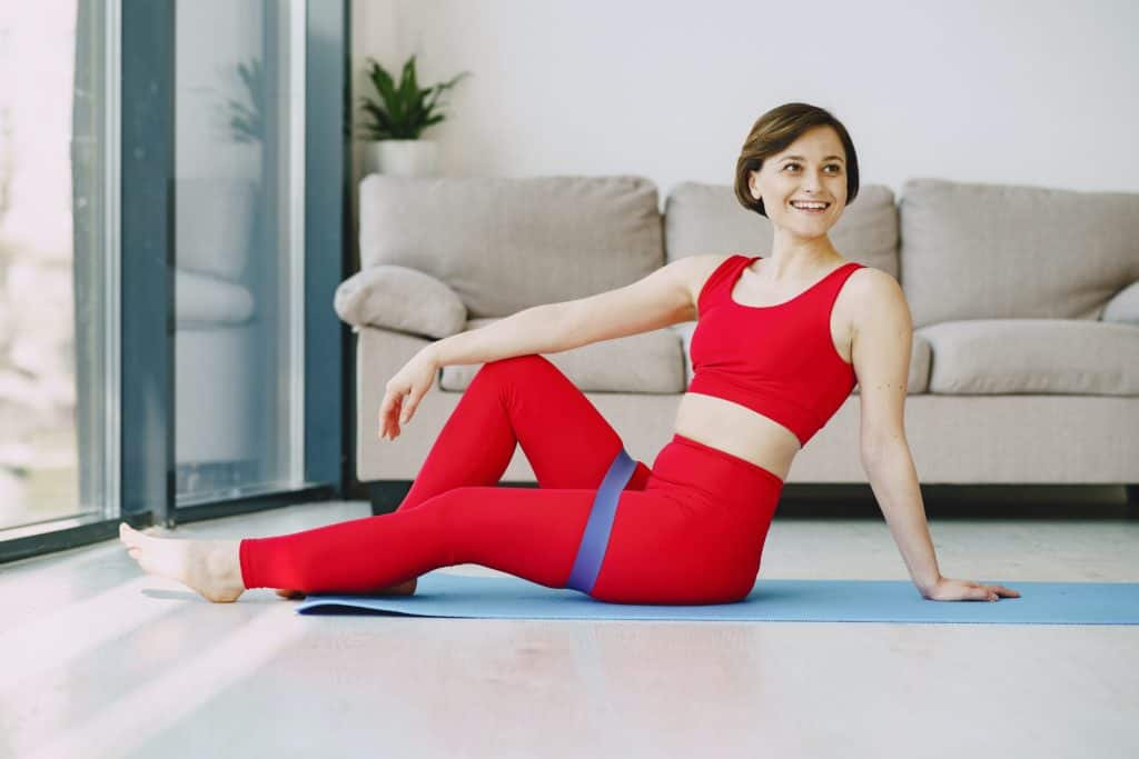 Pilates practitioner using Pilates bands during exercise