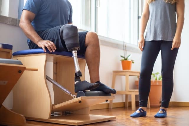 A client works on control during Pilates